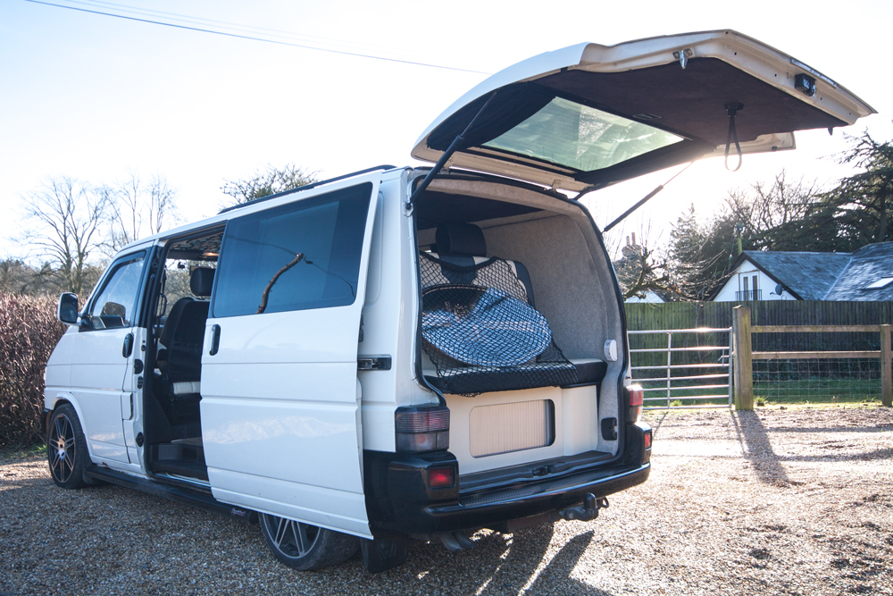 The back of the van, with storage under the bed